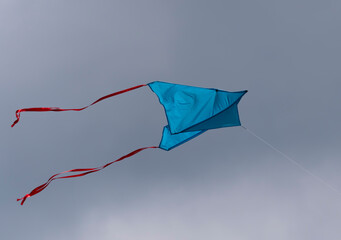 Multicolored kite soaring in the sky