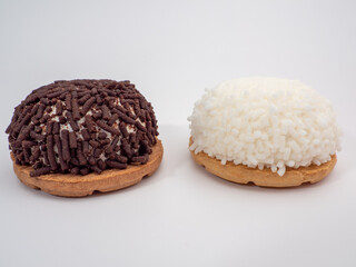 cake with coconut and chocolate chips on a white background.