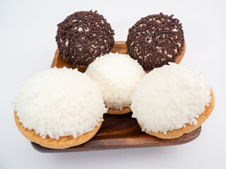 cake with coconut and chocolate chips on a white background.