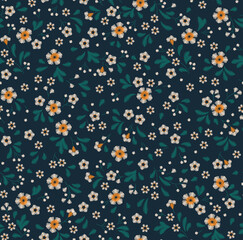 Floral background in vintage style. Decorative embroidery flowers. Vector seamless pattern. Ornament for textiles on dark blue background. Small white flowers. The template for fashion prints.