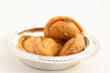 Indian Mithai Gujia Also Called Gujiya, Pirukiya, Pirukia, Pedakiya, Karanji, Basundi Gughra Made Of Suji Ghee Stuffed With Mawa Khoya Chasni Mava Khoa Is Enjoyed On Deepawali, Teez, Holi And Teej