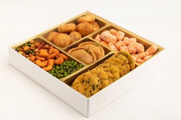 Indian Shahi Mithai Gujia Or Gujiya, Spicy Crispy Snacks Namkeen Also Called Nimki, Mathri, Matar, Kachori, Mixture Decorated in Giftbox. Food Theme For Holi, Deepawali, Rakshabandhan, Dussehra, Rakhi