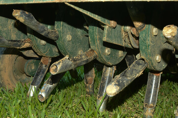 Close up of tines from lawn core aerator 