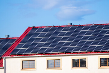 photovoltaic panels on the red roof