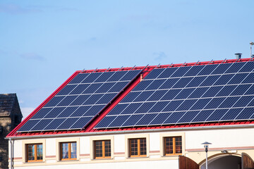 photovoltaic panels on the red roof