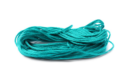 Bright turquoise embroidery thread on white background