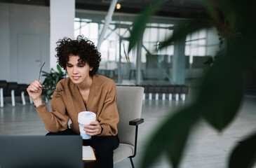 Millennial businesswoman work on laptop in office