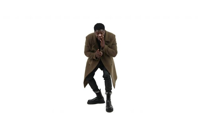 black guy modeling looking at his shoes white background - full shot. High quality 4k footage