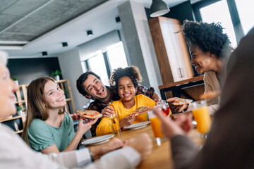 Happy multiethnic multigeneration family with husband, wife, children, grandfather and grandmother