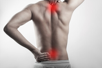 man showing pain in lower back and neck, rhomboid muscle