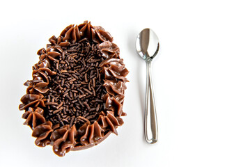 Easter eggs filled with brigadeiro on white background, easter concept.