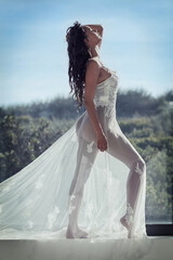 Transparent beauty. Full length shot of a young woman posing in a sheer dress outside.