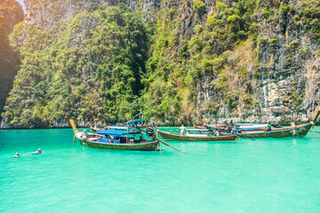 Long tail boat at Pileh lagoon on Phi Phi island, Krabi, Thailand. landmark, destination Southeast Asia Travel, vacation and holiday concept