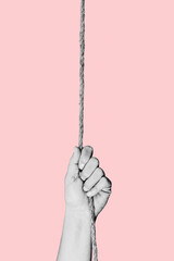 man in black and white pulling a rope