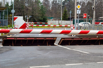 Closed railway crossing, barrier and protective barrier for road safety.