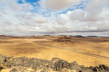 Fototapeta na wymiar Volcanic mountains in Black Desert near the Bahariya Oasis in Egypt.