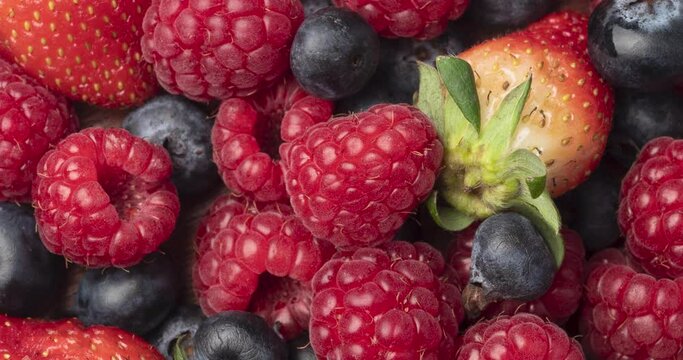 Berries closeup backdrop. Strawberry, raspberry and bluberry