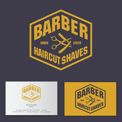 Barber shop logo. Scissors and  razor with letters in geometry hexagon frame. Business card.