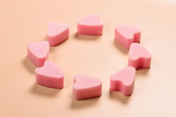 Soft tampons stringless in circle on pink background. New generation. Freedom of movement for girls and women.