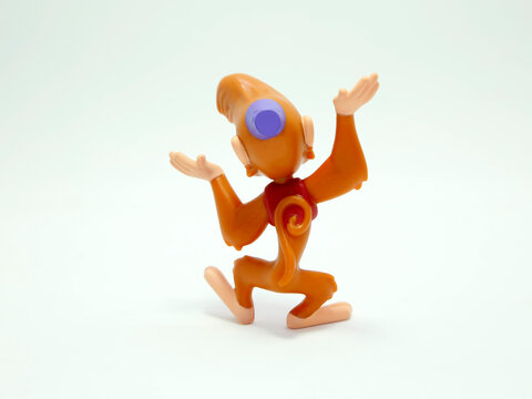 Aladdin. Abu. Ab&uacute;, kleptomaniac monkey from the Walt Disney movie Alladin. McDonald's happy meal toys in commemoration of the Walt Disney World 50th Anniversary celebration. Plastics figures. Isolated