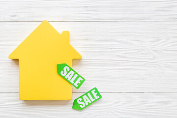 House for sale concept. Sale label with wooden house model