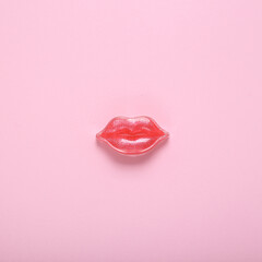 Red lips on a pink background. Beauty minimal concept - obrazy, fototapety, plakaty