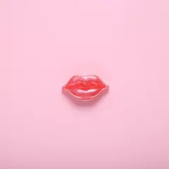 Fotobehang Red lips on a pink background. Beauty minimal concept © splitov27
