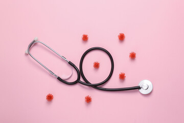 Stethoscope with molecules of virus strains on pink background