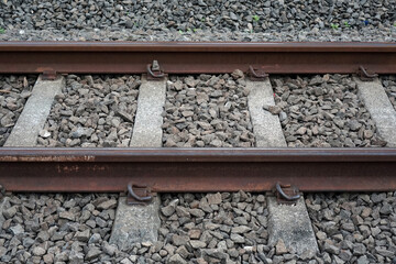 Close up and detailed photos of the commuter rail section and the gravel around it               