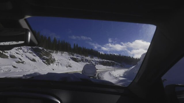 Driving on snowy road. First-person process plate