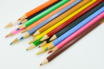 multicolored pencils on a white background