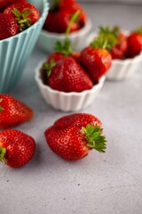 Strawberries on the table top view. Red berries pattern. Strawberry crop. Food still life in the spotlight. Red berry background. Still life.