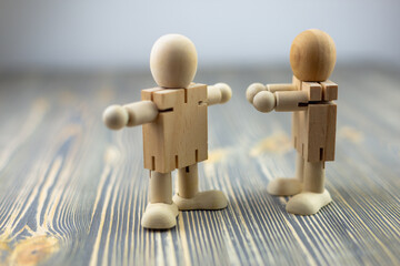 Wooden figure of a man. Concept: sports and gymnastics, exercises.