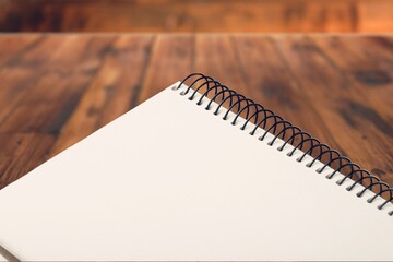 The blank 2022 desk calendar on wooden table.