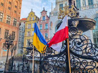 Related flags of ukraine and poland. Symbol of solidarity with Ukraine after Russian invasion.