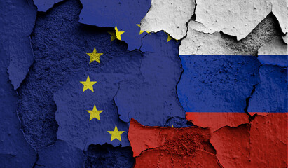 Flag of European Union and Russia on old grunge wall in background
