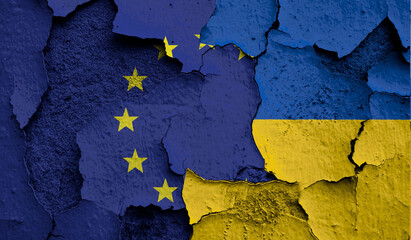 Flag of European Union and Ukraine on old grunge wall in background
