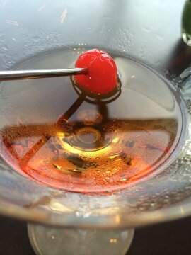 cocktail alcohol surface with cherry on stick, Toranomon Andaz hotel, Tokyo Japan