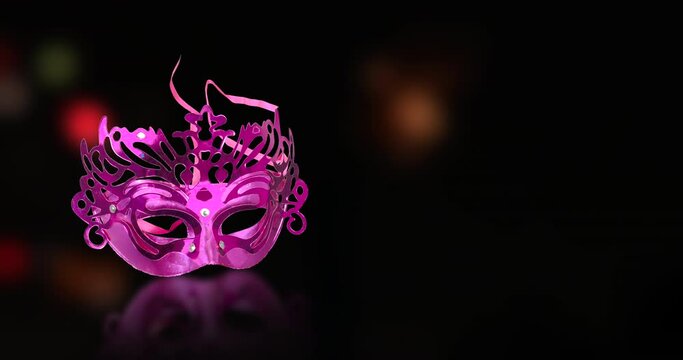 The concept of the Jewish festival Purim celebration. Carnival mask with festival fire bokeh backgrounds.