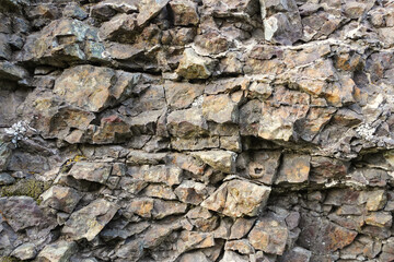 Texture of natural stone rock, background wallpaper white, gray and black splashes on the surface....