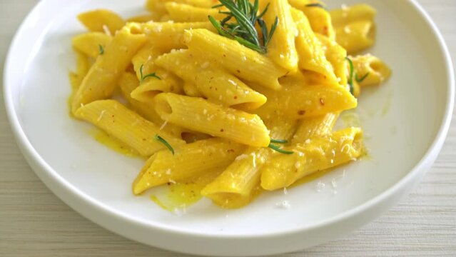 penne pasta with butternut pumpkin creamy sauce and rosemary