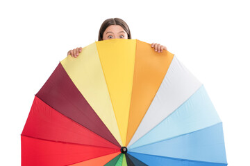 child hiding behind colorful parasol. kid with rainbow umbrella isolated on white.