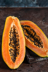 sliced papaya on wooden background