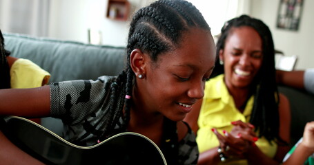 Happy black African american family using laptop
