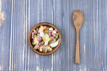Food in a wooden bowl on a wooden table. Ecology.