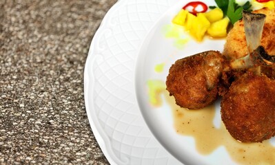 Meat marinated and cooked with sauce. National dish.