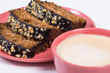 Pastry made of zucchini and cup of white coffee. Delicious dessert. White background