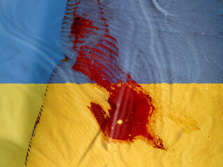 Bloody war in Ukraine. Fatalities, Civilians Killed Concept. The flag of Ukraine background