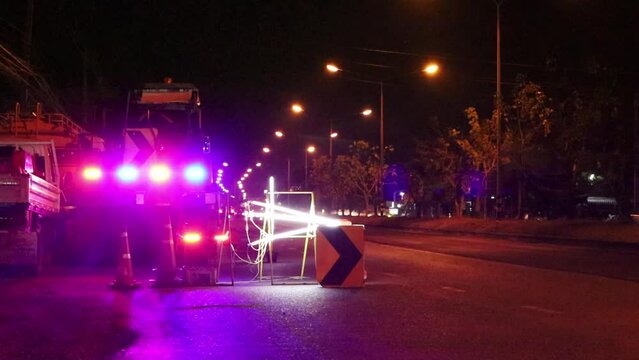 Warning lights flashing on the road. Multicolored flashing lights warn road drivers to be on the lookout for safety on roads being repaired.