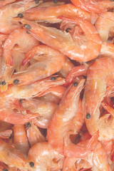 Shrimps background texture. A lot of shrimps. Cooked shrimps.